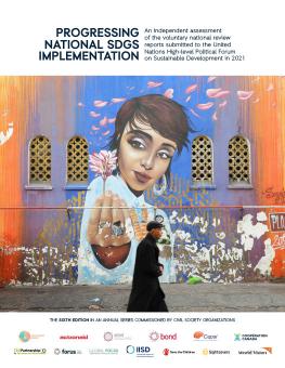 Progressing National SDGs Implementation 2021 cover showing person walking by large wall mural
