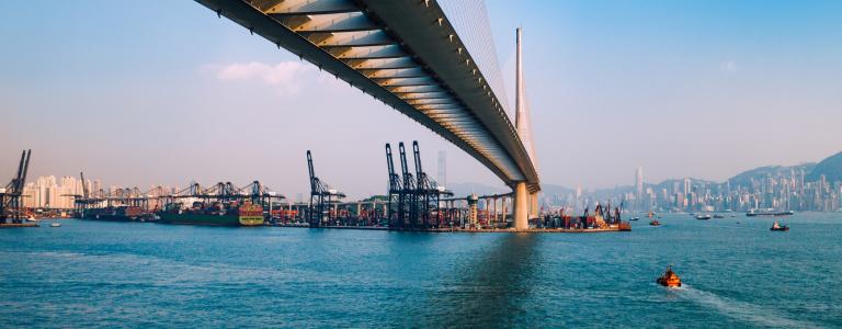 Bridge in Hong Kong and Container Cargo freight ship