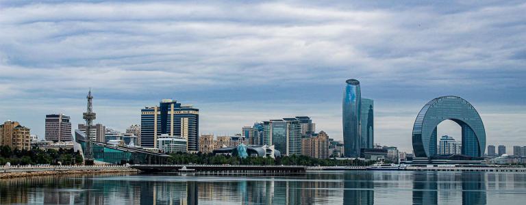 Photo of the city of Baku from accross the water. Photo by İltun Huseynli on Unsplash.