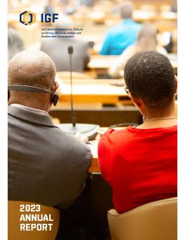 IGF 2023 Annual Report cover showing two attendees sitting in the venue at the 2023 IGF annual general meeting.