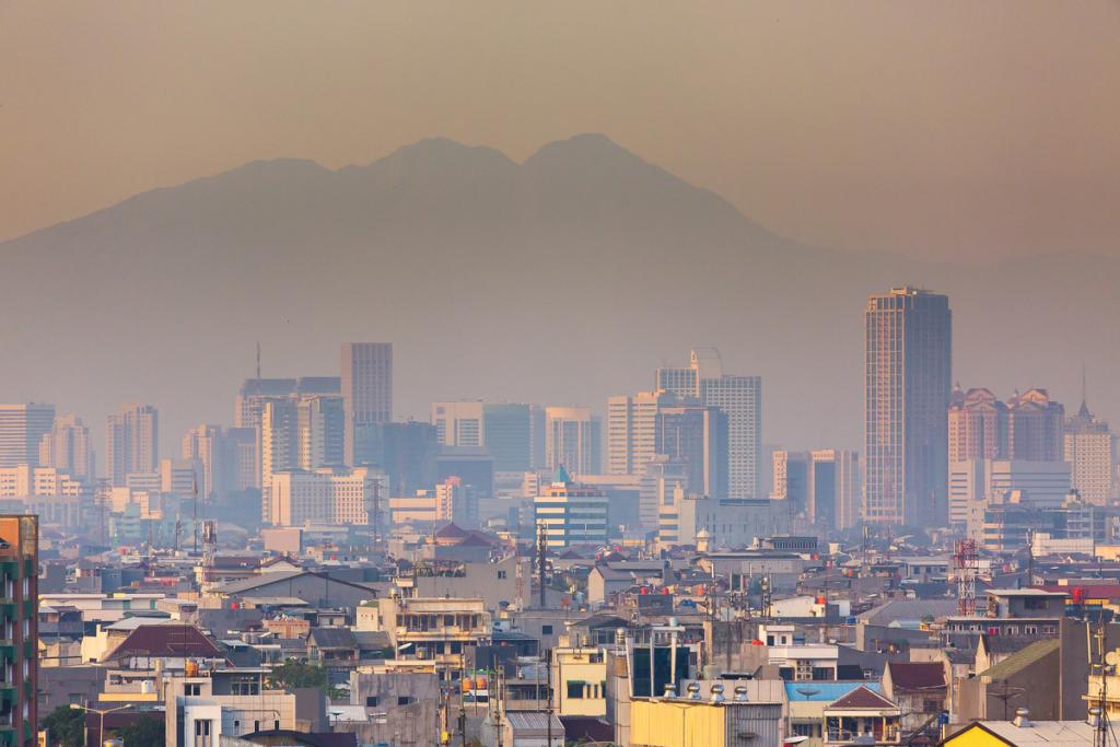 Smog-filled cityscape with a mountain in the background.