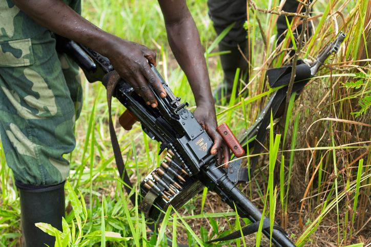  In North Kivu, DRC, a rebel soldier checks his weapon before patrols. 